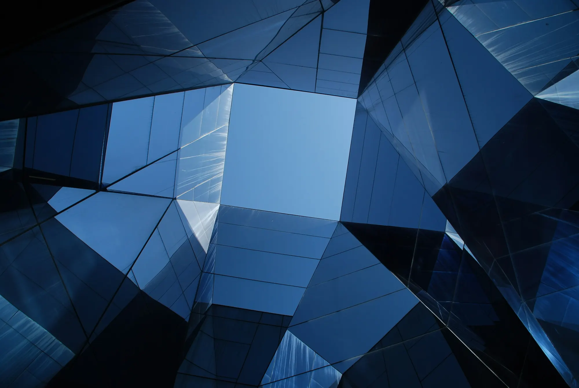Geometric glass curtain wall seen from below